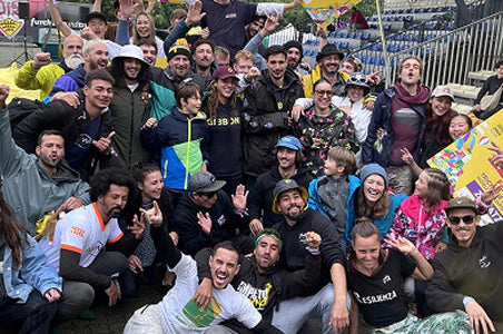 Slackline event with crowd at a lake (desktop)