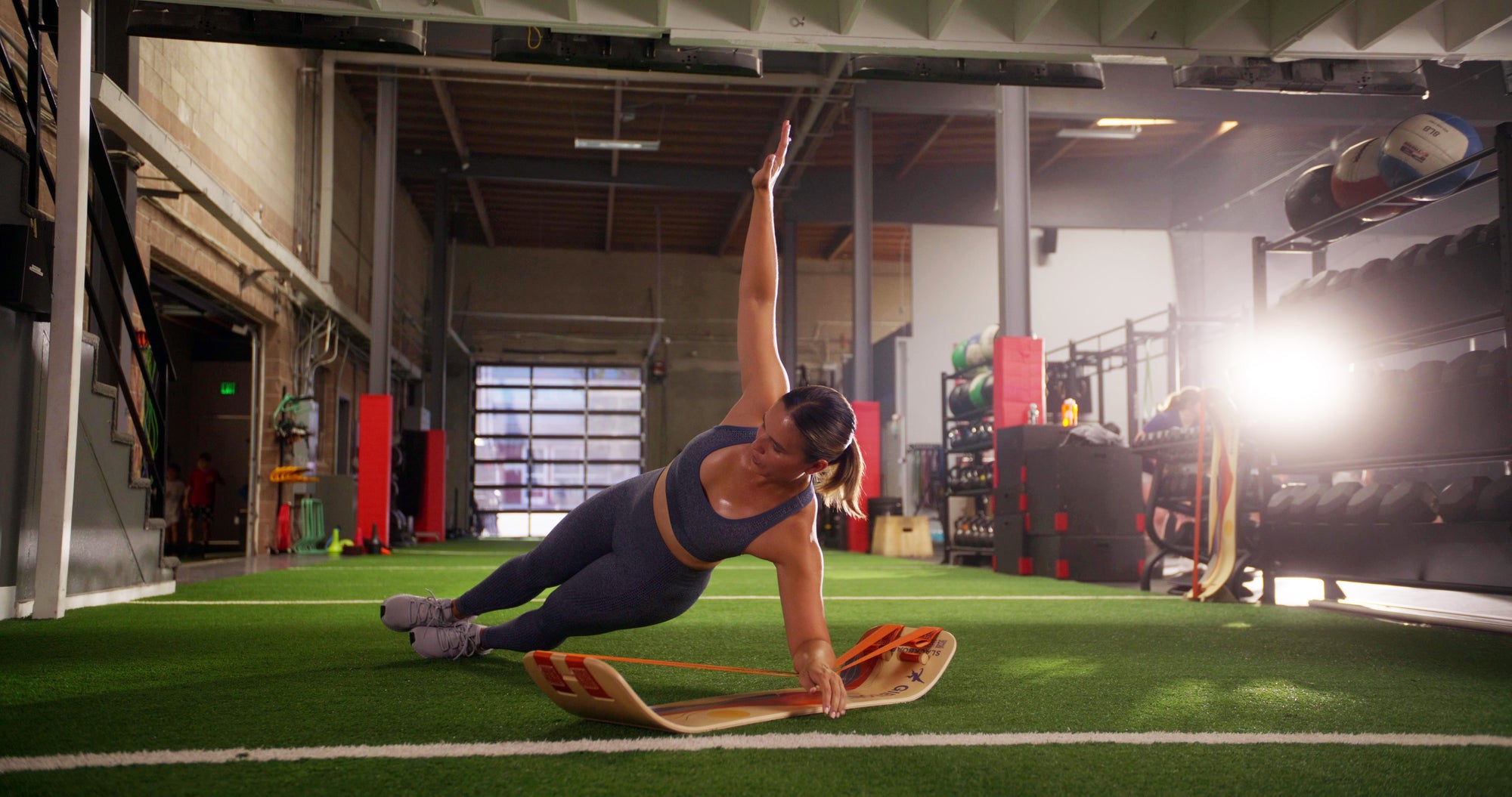 Person exercising with resistance bands in a gym setting
