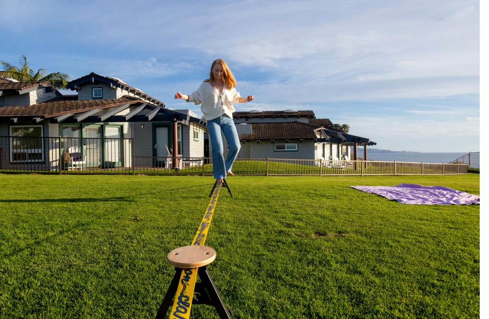 Woman balancing confidently on the SlackYard