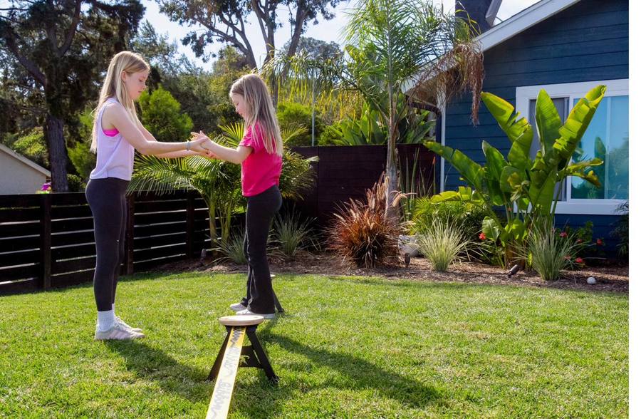Two children celebrating on the SlackYard